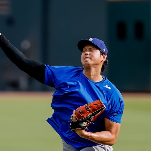 Los Angeles Dodgers pitcher Shohei Ohtani throws a practice session in the outfield before a baseball game against the Atlanta Braves, Thursday, Aug. 27, 2026, in Atlanta. (AP Photo/Erik S. Lesser)