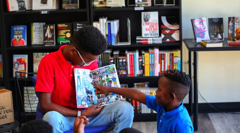 Sidney Keys III helps out in the Books N Bros book club. Graphic novels on Black history are popular selections for club members. Courtesy of Books N Bros