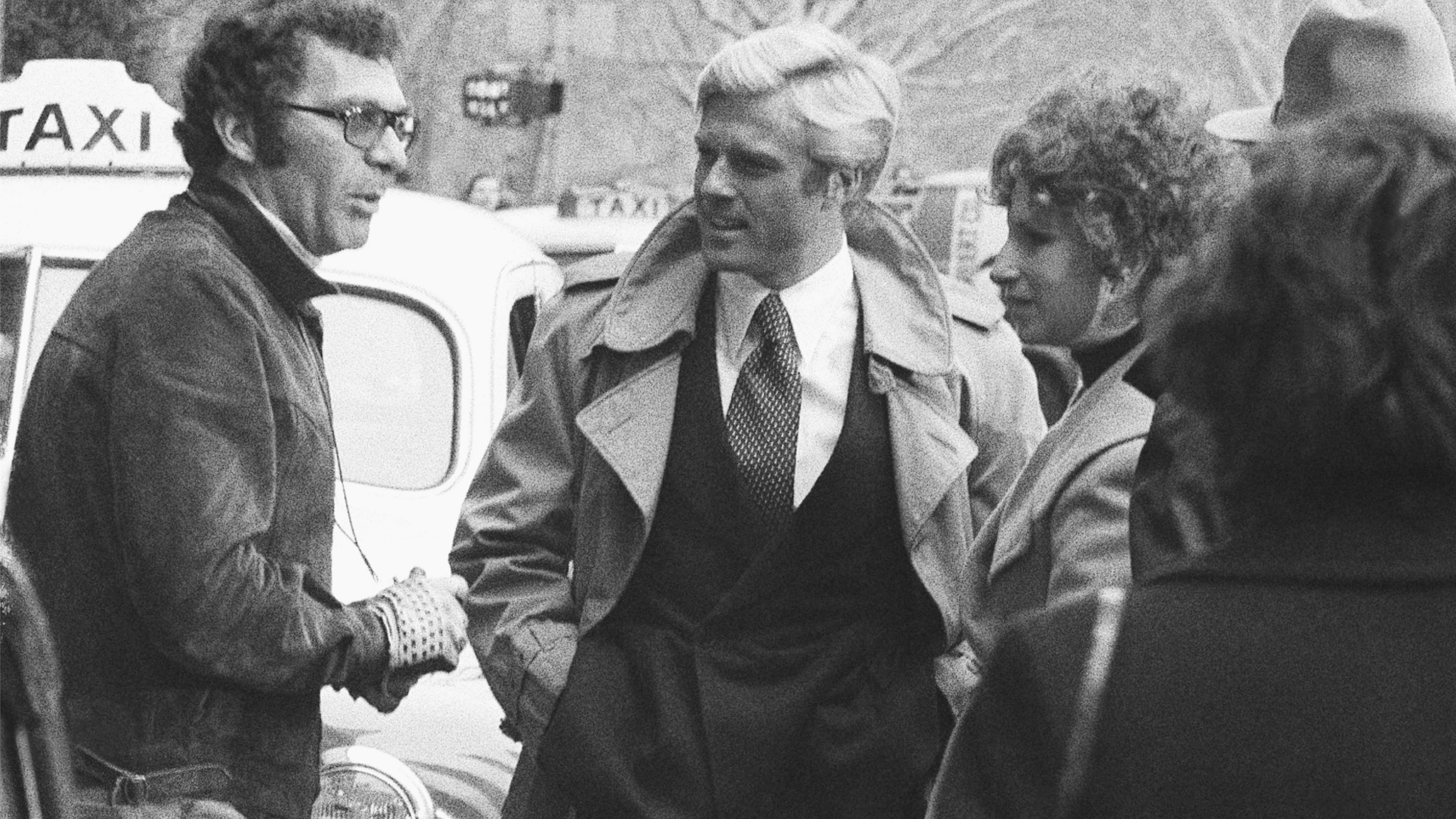 FILE - Director Sydney Pollack, left, appears with actors Robert Redford, center, and Barbra Streisand during the filming of "The Way We Were" in New York on Nov. 28, 1972. (AP Photo/Marty Lederhandler, File)