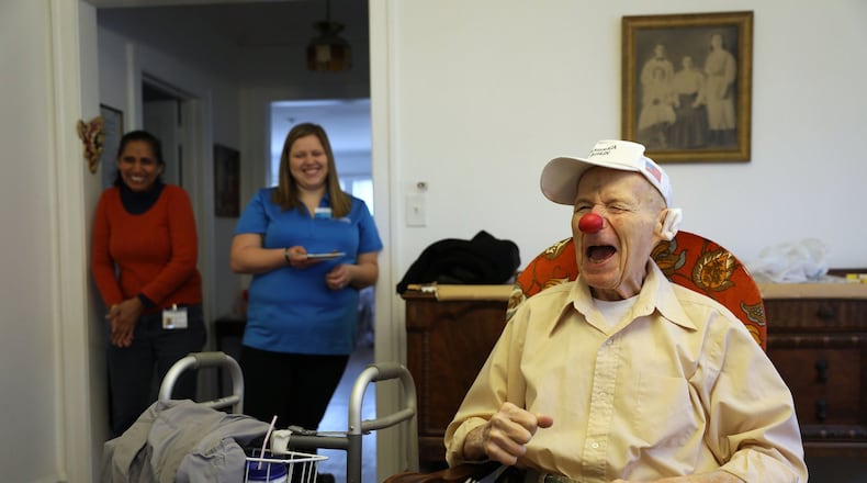 Frank Shapira (cq), 91, right, who once did clowning as a hobby, jokes with Open Arms Solutions caregiver Kamlesh Debi (cq), left, and care coordinator Katrina Betts Monday, Nov. 20, 2017 at Shapira’s Skokie apartment, where he receives 24-hour home health care. (Chris Walker/Chicago Tribune/TNS)