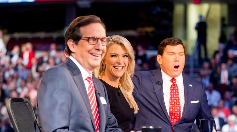 Fox News moderators from left, Chris Wallace, Megyn Kelly and Bret Baier speak to the camera before the first GOP presidential debate in August 2015, held in Cleveland. AP/Andrew Harnik