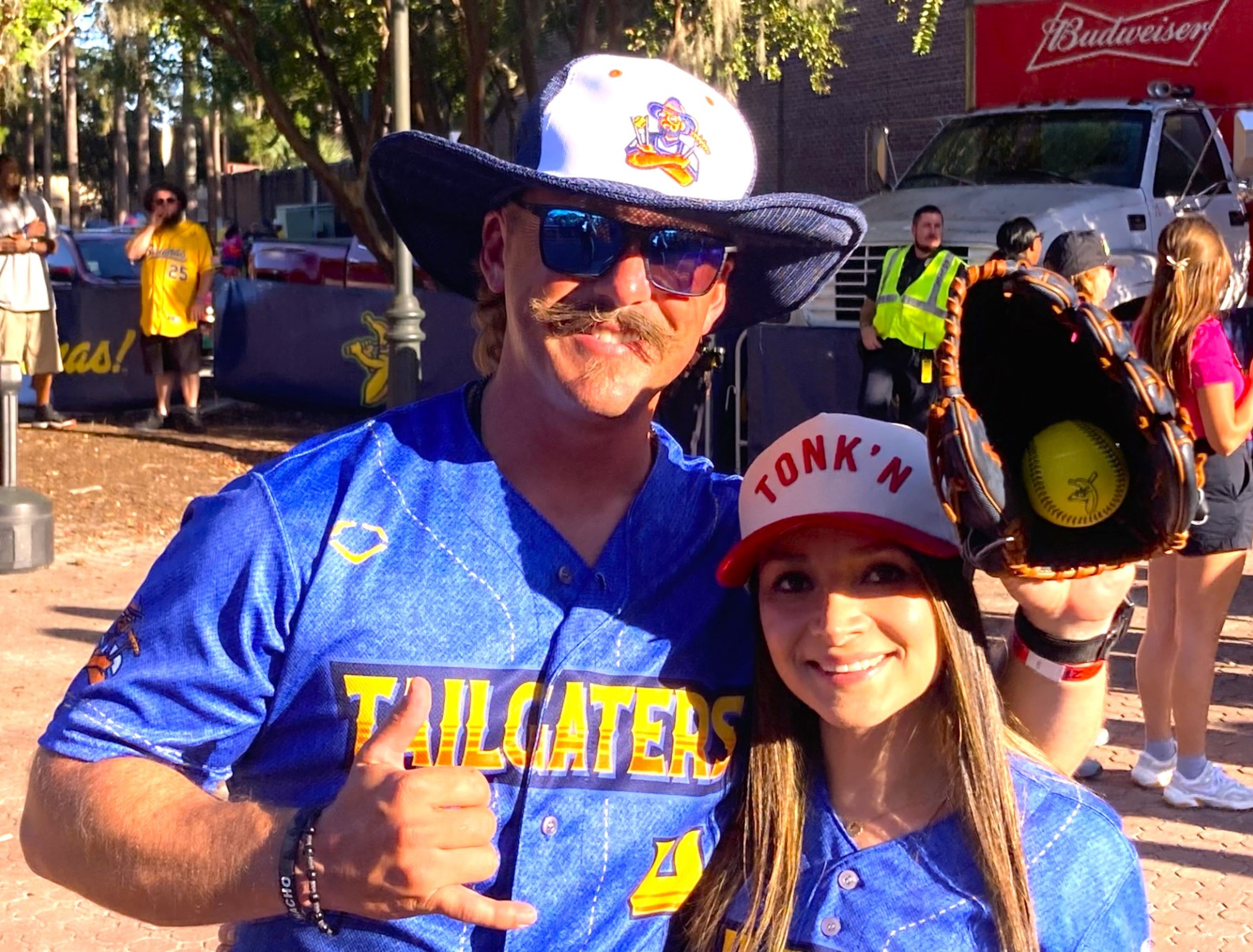 Will Lindsey and Carla Silva, a couple from El Paso, Texas, traveled to Savannah to root on the Texas Tailgaters in the Banana Ball playoffs on Oct. 3, 2025 at Savannah's Grayson Stadium. (Adam Van Brimmer/AJC)