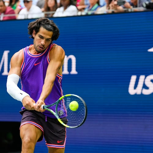 Carlos Alcaraz, of Spain, returns the ball during a mixed doubles match at the U.S. Open tennis championships, Tuesday, Aug. 25, 2026, in New York. (AP Photo/Yuki Iwamura)