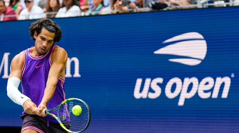 Carlos Alcaraz, of Spain, returns the ball during a mixed doubles match at the U.S. Open tennis championships, Tuesday, Aug. 25, 2026, in New York. (AP Photo/Yuki Iwamura)