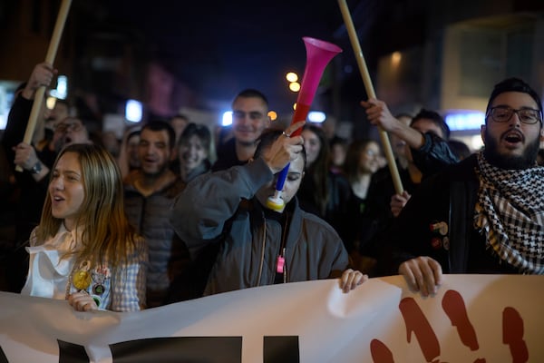 Students chant during an anti-corruption protest in the southwestern town of Novi Pazar, Serbia, Friday, April 11, 2025. (AP Photo/Marko Drobnjakovic)