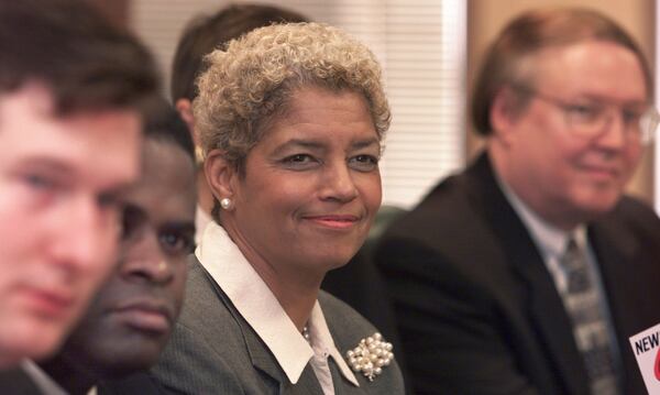 Shirley Franklin (center) on November 29, 2001, when she was Atlanta’s mayor-elect. At left are Peter Aman (far left) and Kasim Reed — then-members of Franklin’s transition team. Now Reed is wrapping up his second term as Atlanta mayor, and Aman is one of the many 2017 candidates who hope to become Reed’s successor. 