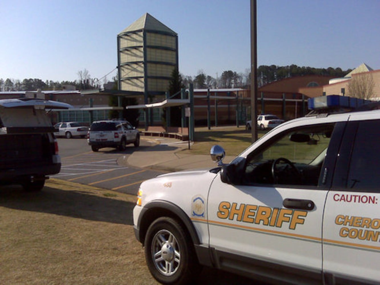 Police surround Woodstock High, remove gun