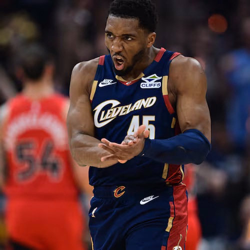 Cleveland Cavaliers guard Donovan Mitchell reacts after an assist during the first half in Game 1 of a first-round NBA playoffs basketball series against the Toronto Raptors, Saturday, April 18, 2026, In Cleveland. (AP Photo/David Dermer)