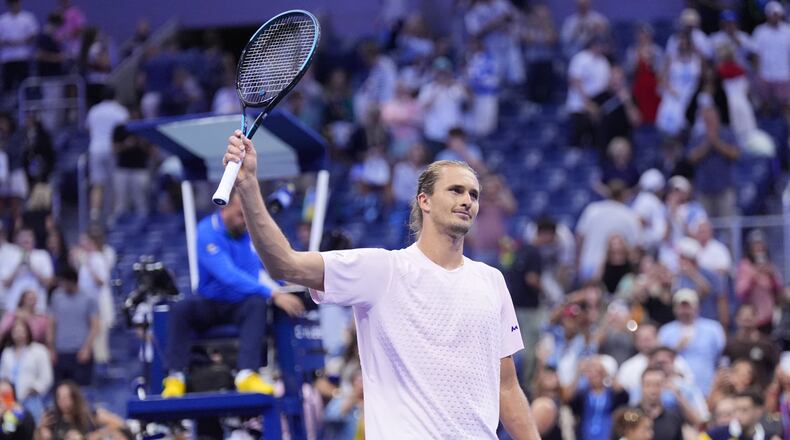 Alexander Zverev, of Germany, acknowledges fans after defeating Lorenzo Sonego, of Italy, in five sets in the first round of the U.S. Open tennis championships early Wednesday, Sept. 2, 2026, in New York. (AP Photo/Frank Franklin II)