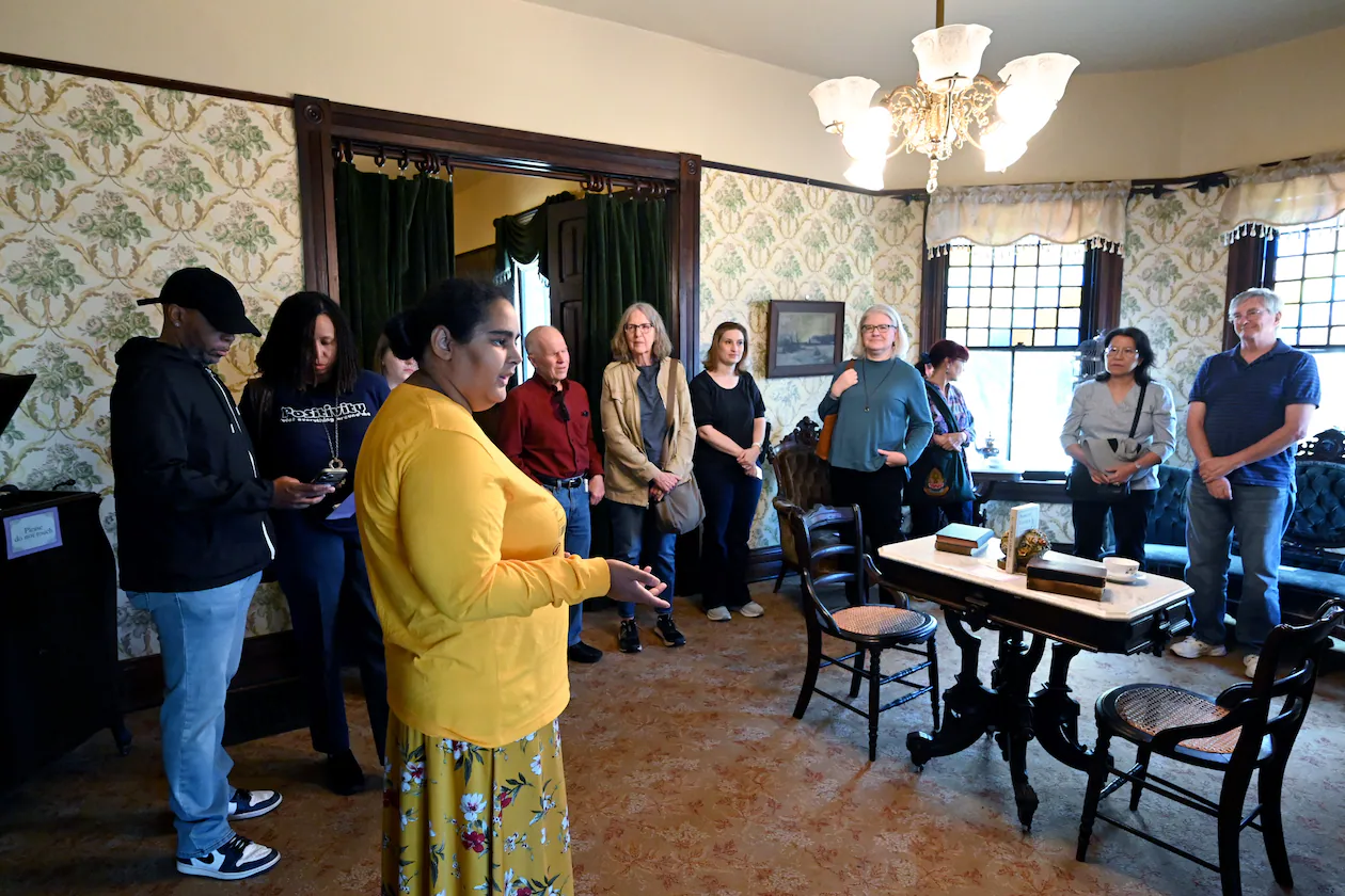 Guide associate Lesley Le Platte leads a tour on Saturday, March 21, 2026, for guests at the Wren’s Nest, the house museum that was the home of Joel Chandler Harris, author of Uncle Remus folktales first published in book form in 1881. (Hyosub Shin/AJC)