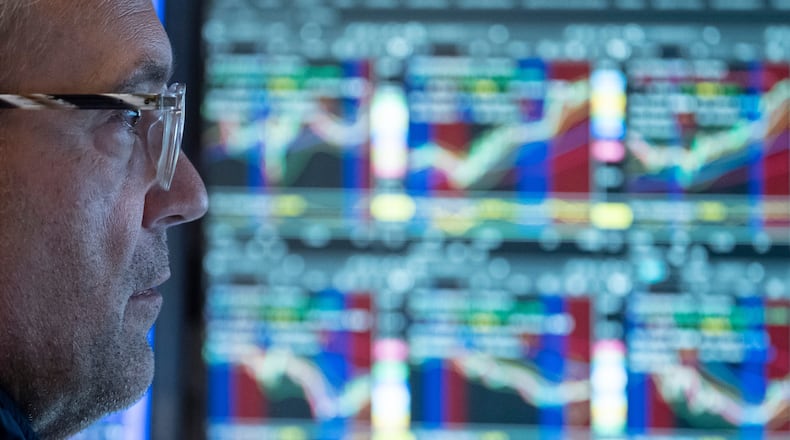 Specialist Anthony Matesic works on the floor of the New York Stock Exchange in New York, Friday, Aug. 21, 2026. (AP Photo/Yuki Iwamura)