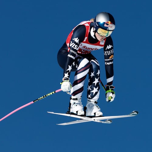 United States' Lindsey Vonn speeds down the course during an alpine ski, women's World Cup downhill, in St. Moritz, Switzerland, Saturday Dec. 13, 2025. (AP Photo/Gabriele Facciotti)