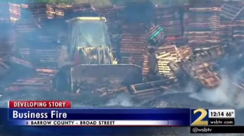 A fire at a pallets business in Barrow County closed a key roadway for part of Wednesday morning. (Credit: Channel 2 Action News)