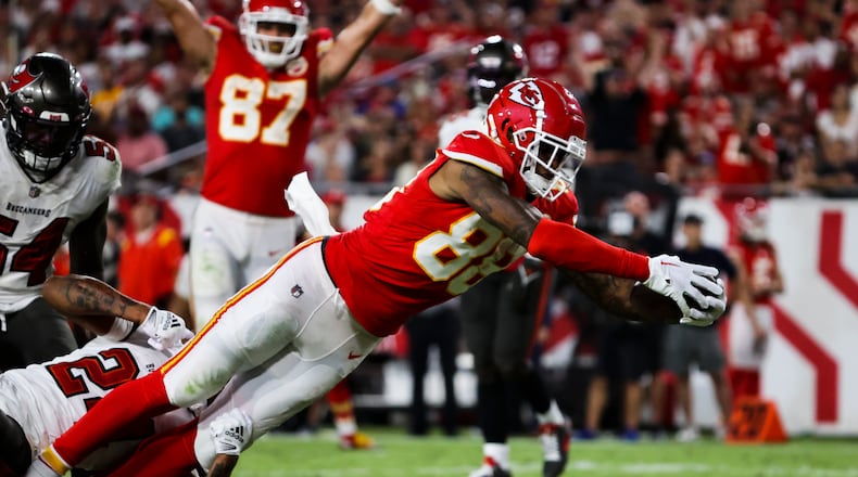 Kansas City Chiefs tight end Jody Fortson (88) scores a touchdown on a 10-yard pass from Patrick Mahomes (15) as he gets by Tampa Bay Buccaneers cornerback Carlton Davis III (24) during third-quarter action at Raymond James Stadium on Sunday, Oct. 2, 2022, in Tampa. (Dirk Shadd/Tampa Bay Times/TNS)