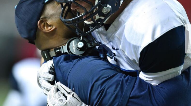 December 12, 2015 Atlanta: Pace Academy's Kyle Orr jumps into the arms of head coach Chris Slade after sealing the win over Fitzgerald in the Class AA State Championship win over Fitzgerald at the Georgia Dome Saturday December 12, 2015. BRANT SANDERLIN/BSANDERLIN@AJC.COM December 12, 2015 Atlanta: Pace Academy's Kyle Orr jumps into the arms of head coach Chris Slade after sealing the win over Fitzgerald in the Class AA State Championship win over Fitzgerald at the Georgia Dome Saturday December 12, 2015. BRANT SANDERLIN/BSANDERLIN@AJC.COM