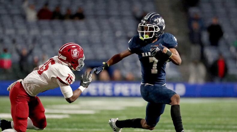 Marietta wide receiver Ricky White (7) makes a move on Lowndes defensive back Tylar Belcher (15) in the first half of the Class AAAAAAA high school football state title game at Georgia State Stadium Saturday, December 14, 2019 in Atlanta. (JASON GETZ/SPECIAL TO THE AJC)