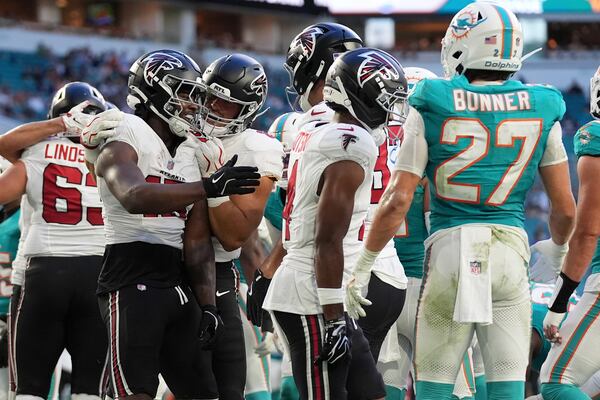 Falcons running back Brian Robinson Jr. (second from left) celebrates with teammates after scoring against the Dolphins during their NFL exhibition game on Friday, Aug. 28, 2026, in Miami Gardens, Fla. (Lynne Sladky/AP)