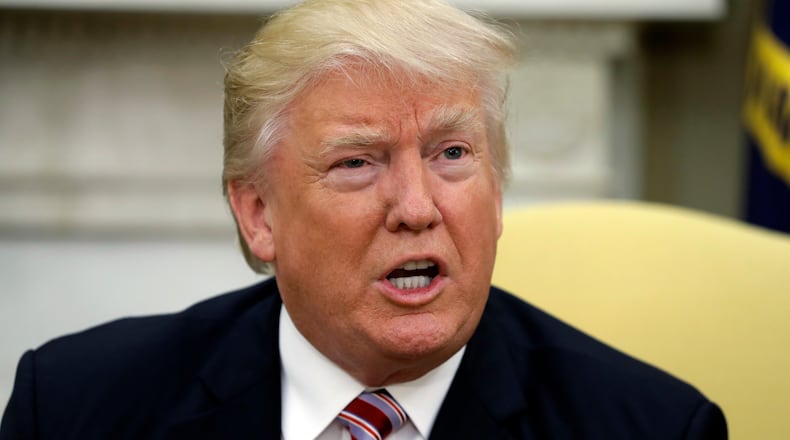 President Donald Trump talks to reporters during a meeting with Henry Kissinger, former secretary of state and national security adviser under President Richard Nixon, in the Oval Office of the White House in Washington on Wednesday. AP/Evan Vucci