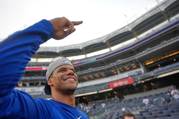 New York Mets' Juan Soto greets fans before a baseball game against the New York Yankees Friday, May 16, 2025, in New York. (AP Photo/Seth Wenig)