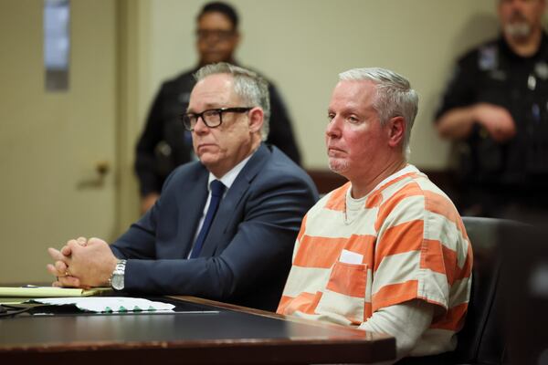Defense attorney Brian Hobbs, left, sits with client Colin Gray, father of Colt Gray, during a calendar call before Barrow County Superior Court Judge Nicholas Primm at Barrow County Superior Court in February 2025. (Jason Getz/AJC 2025)