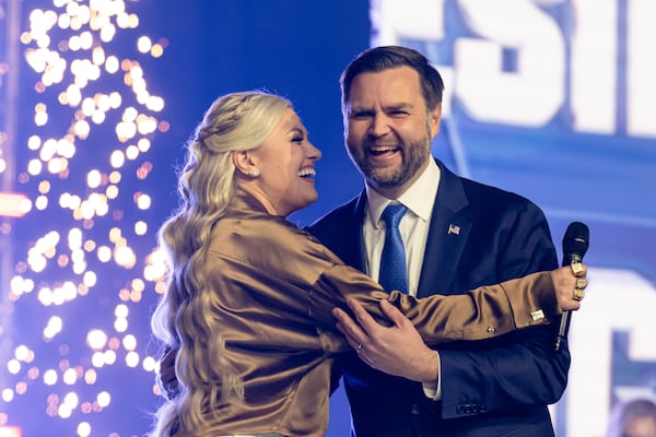 Turning Point USA CEO and chair Erika Kirk (left) greets Vice President JD Vance during Turning Point USA's AmericaFest 2025 in December in Phoenix. (Jon Cherry/AP)