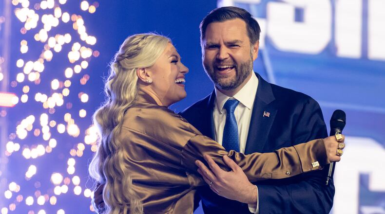 Turning Point USA CEO and chair Erika Kirk (left) greets Vice President JD Vance during Turning Point USA's AmericaFest 2025 in December in Phoenix. Vance and Kirk are scheduled to appear at Turning Point's event April 14 at the University of Georgia in Athens. (Jon Cherry/AP)