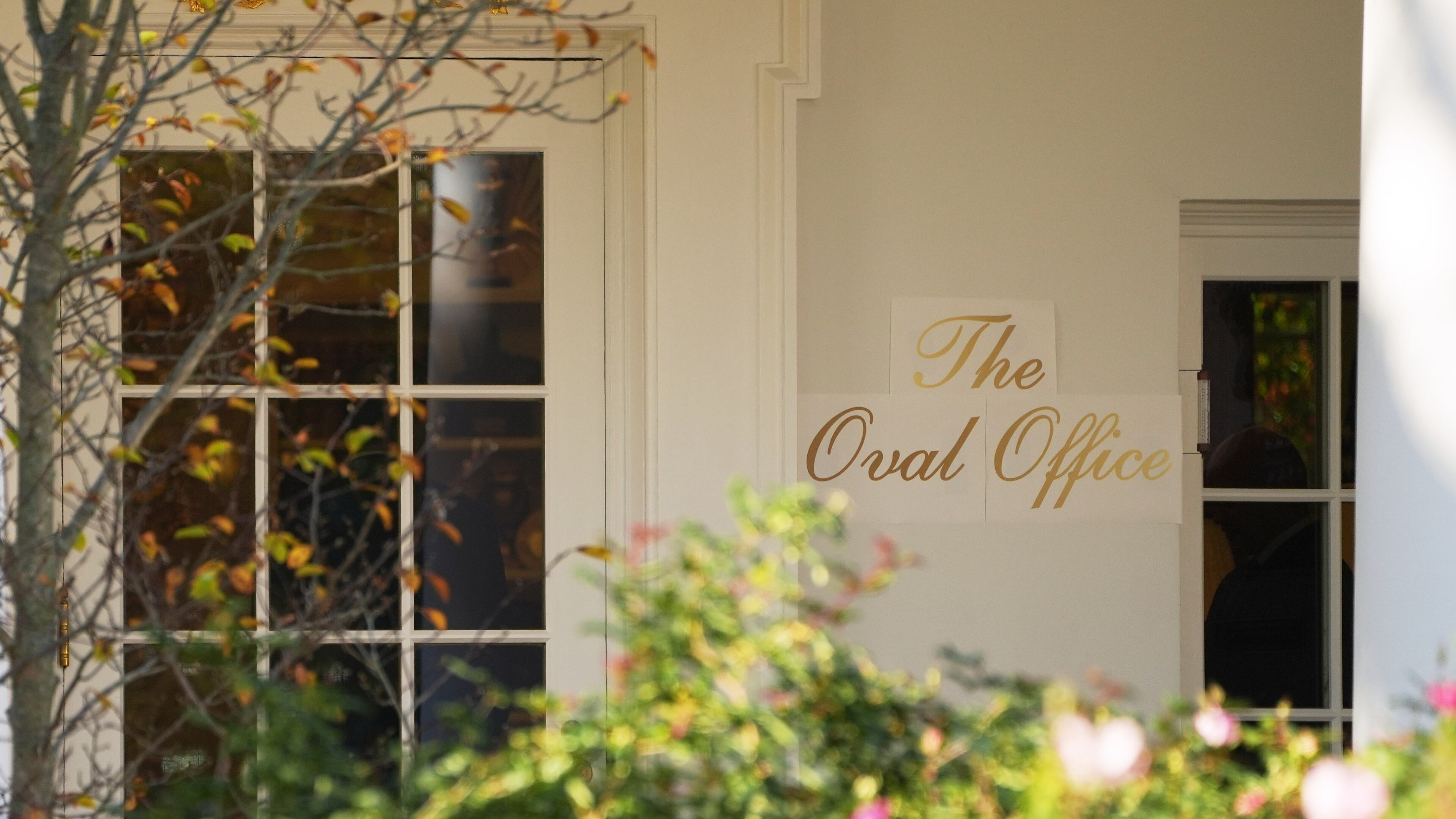 A sign is seen outside the Oval Office before President Donald Trump walks out to board Marine One on the South Lawn of the White House, Wednesday, Nov. 5, 2025, in Washington. (AP Photo/Evan Vucci)