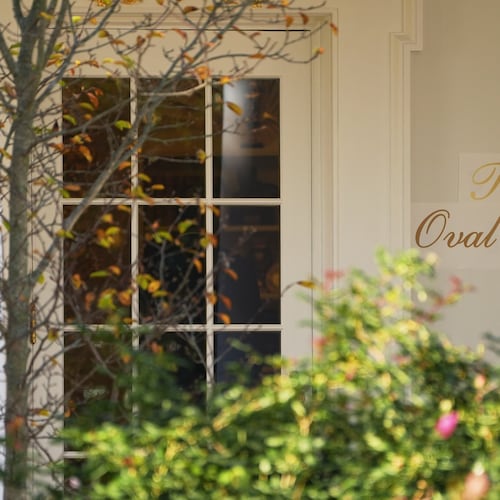 A sign is seen outside the Oval Office before President Donald Trump walks out to board Marine One on the South Lawn of the White House, Wednesday, Nov. 5, 2025, in Washington. (AP Photo/Evan Vucci)