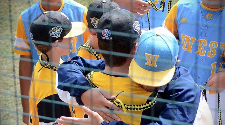 Players from Peachtree City, Georgia and Honolulu, Hawaii hug before facing off in the U.S. Championship of the Little League World Series on Aug. 25 at Howard J. Lamade Stadium in Williamsport, Pennsylvania.