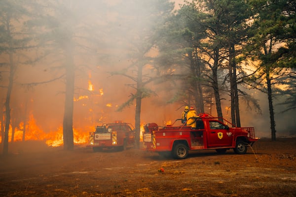 Firefighters battle a wildfire in Ocean County, N.J. on Thursday, April 24, 2025. (New Jersey Department of Environmental Protection via AP)