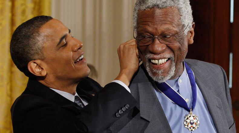 U.S. President Barack Obama (L) presents Basetball Hall of Fame member and human rights advocate Bill Russell the 2010 Medal of Freedom in the East Room of the White House February 15, 2011 in Washington, DC. Obama presented the medal to twelve pioneers in sports, labor, politics and arts. (Photo by Chip Somodevilla/Getty Images)