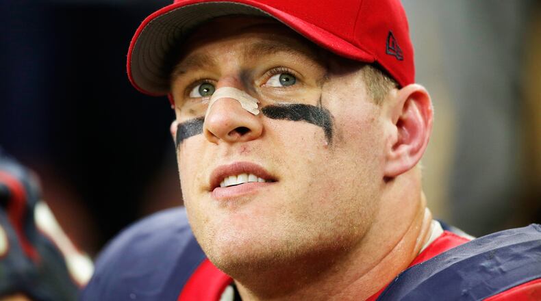 J.J. Watt of the Texans sits on the bench late in a 2014 game against the Jaguars at NRG Stadium in Houston. He and his teammates are keeping an eye on Hurricane Harvey has it heads for the east coast of Texas.