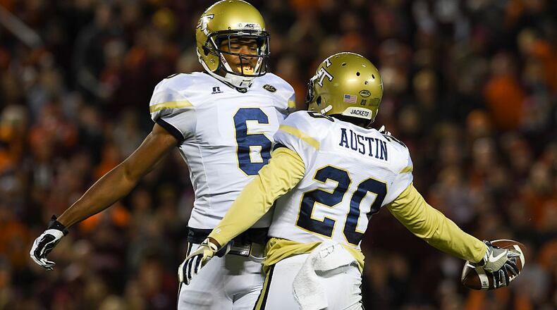Lawrence Austin enjoys the moment with teammate Lamont Simmons. (Michael Shroyer/Getty Images)