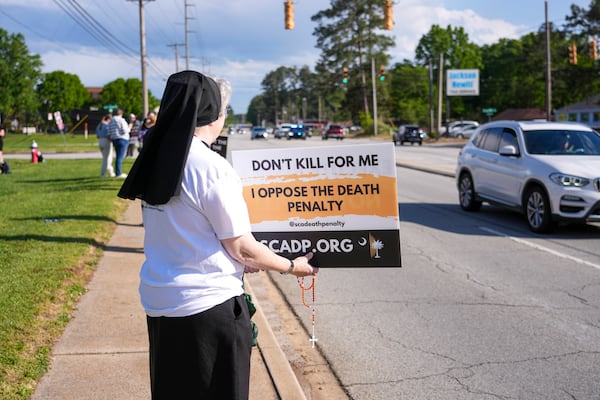 Sister Pamela Smith demonstrates outside the site of the scheduled execution of South Carolina inmate Mikal Mahdi in Columbia, S.C., Friday, April 11, 2025. (AP Photo/David Yeazell)