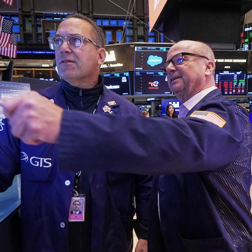 Specialist Anthony Matesic, left, and trader Patrick Casey work on the floor of the New York Stock Exchange, Tuesday, Nov. 18, 2025. (AP Photo/Richard Drew)