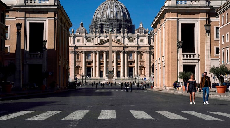 FILE - A view of St. Peter's Basilica at the Vatican, March 11, 2020. (AP Photo/Andrew Medichini, File)