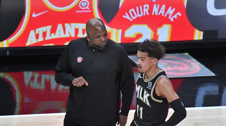 Atlanta Hawks head coach Nate McMillan instructs Atlanta Hawks guard Trae Young (11) during the first half in an NBA basketball game at State Farm Arena on Wednesday, May 5, 2021. (Hyosub Shin / Hyosub.Shin@ajc.com)
