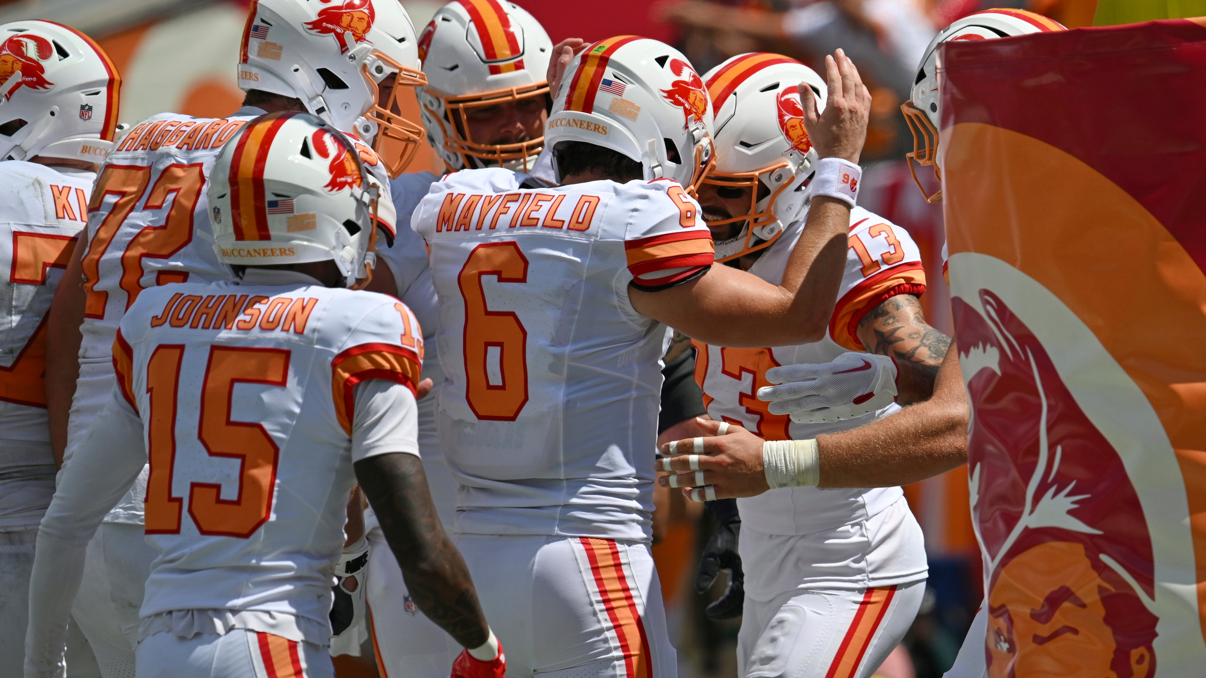 Tampa Bay Buccaneers quarterback Baker Mayfield (6) celebrates with wide receiver Mike Evans (13) after Evans scored a touchdown during the first half of an NFL football game against the New York Jets Sunday, Sept. 21, 2025, in Tampa, Fla. (AP Photo/Jason Behnken)