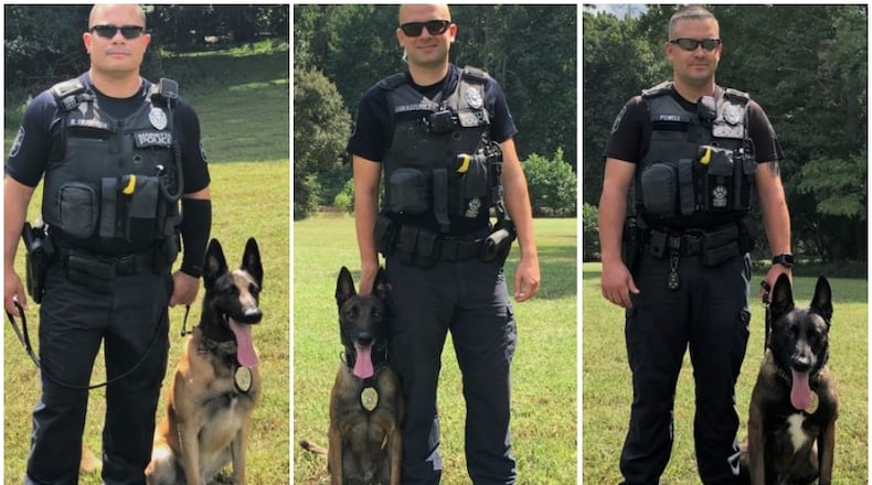 These three very good boys are now officially sworn Marietta police officers with badges and everything.