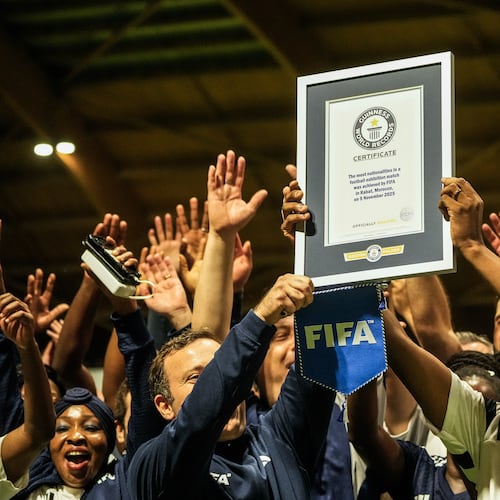 People celebrate after breaking the Guinness World Record for most nationalities in an exhibition soccer match organized by FIFA, in Rabat, Morocco, Wednesday, Nov. 5, 2025. (AP Photo/Mosa'ab Elshamy)