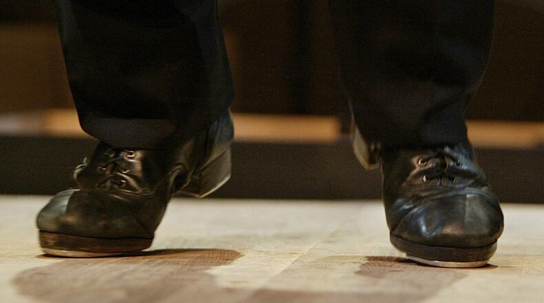 FILE - Tap sensation Savion Glover dances a number during a dress rehearsal for "Classical Savion," Jan. 4, 2005, at the Joyce Theater in New York. (AP Photo/Kathy Willens, File)