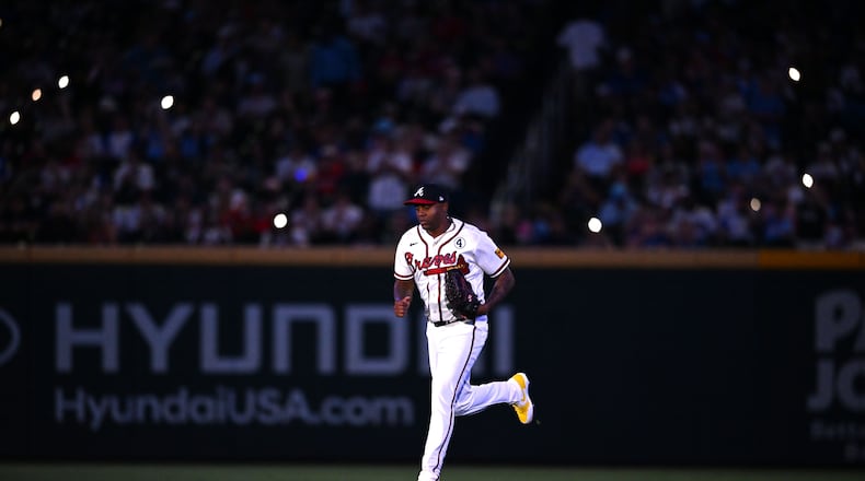 Atlanta Braves pitcher Raisel Iglesias (26) runs onto the baseball filed during the ninth inning of a baseball game at Truist Park, Tuesday, June 2, 2026, in Atlanta. Atlanta Braves won 4-3 over Toronto Blue Jays. (Hyosub Shin/AJC)