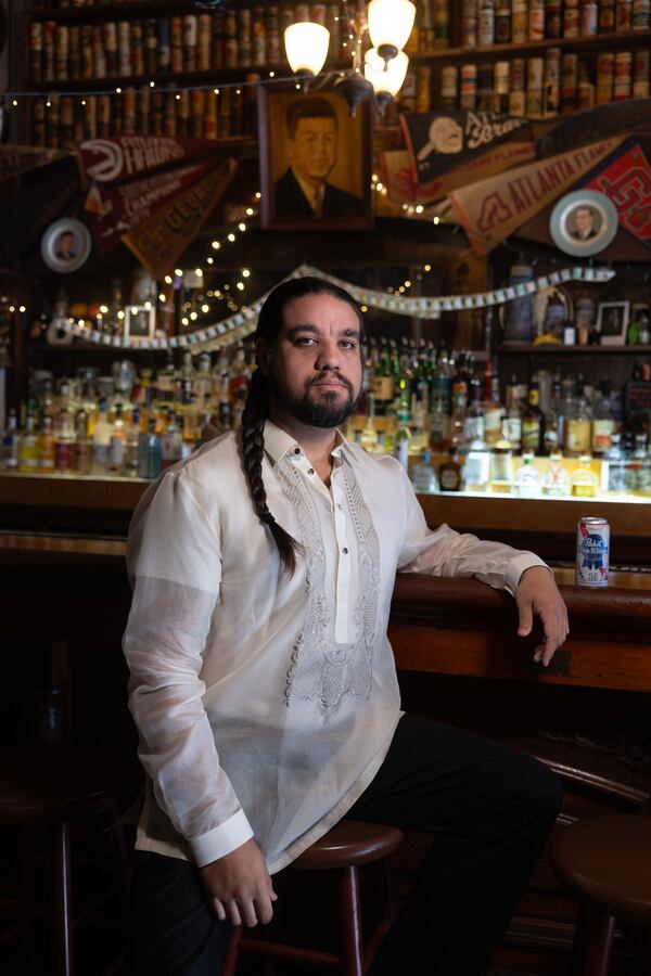 David Samonte, 37, wears a barong at Manuel’s Tavern in Atlanta. (Arvin Temkar/AJC)