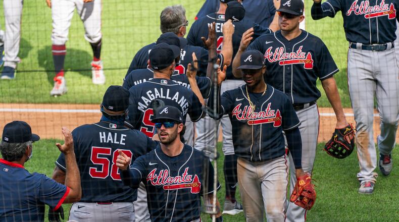 The Atlanta Braves celebrate their 8-4 win over the Washington Nationals Sunday, Sept. 13, 2020, in Washington. (Manuel Balce Ceneta/AP)