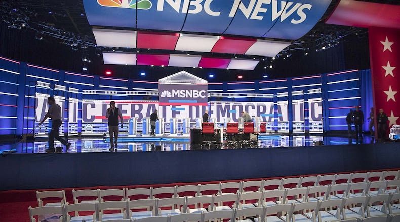 Crews continue to work on the final touches of the debate stage a day before the televised MSNBC/The Washington Post Democratic Presidential debate inside the Oprah Winfrey Soundstage at Tyler Perry Studios in Atlanta. (Alyssa Pointer/Atlanta Journal Constitution)