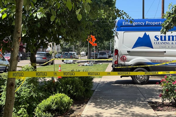 Police tape cordons off an area outside the Union Gospel Mission homeless shelter in Salem, Ore., Monday, June 2, 2025. (AP Photo/Claire Rush)