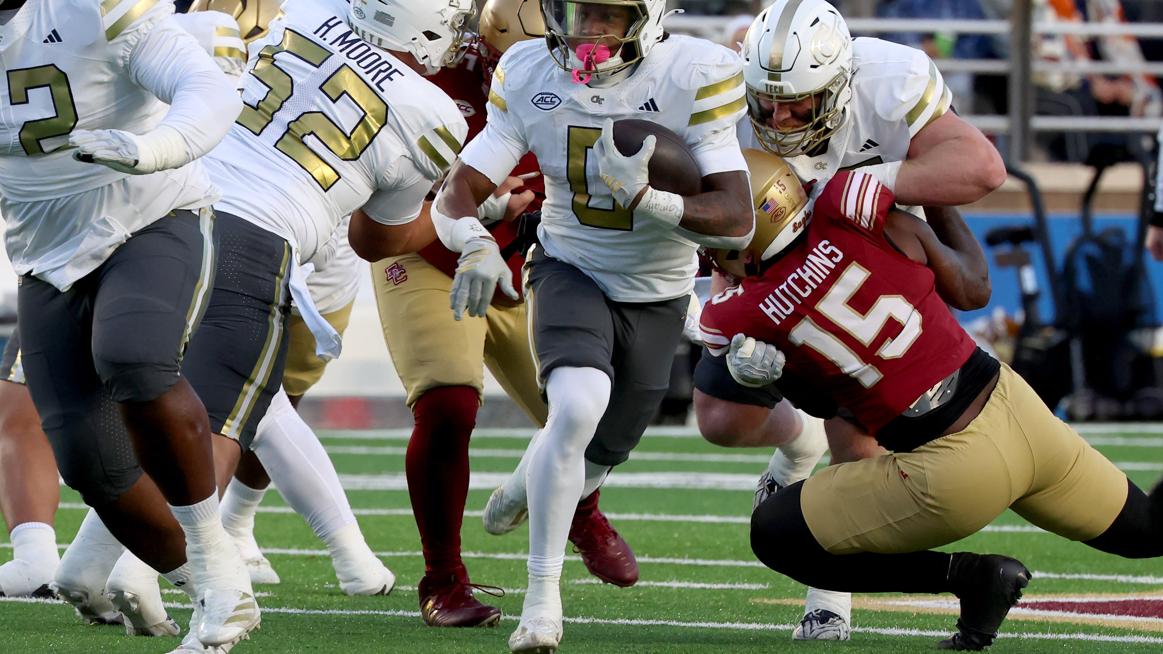 Georgia Tech running back Malachi Hosley, center, runs the ball during the first half of an NCAA college football game against Boston College, Saturday, Nov. 15, 2025, in Boston. (AP Photo/Mark Stockwell)