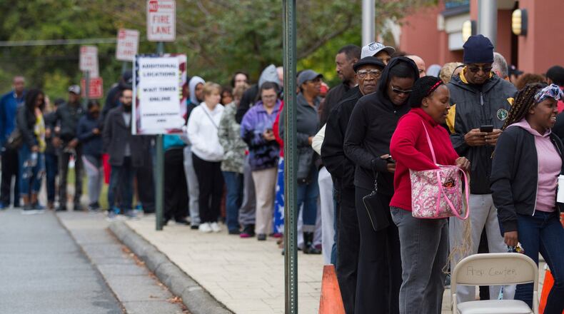 People wait in a long line to vote Saturday at the Cobb County Board of Elections and Registration office in Marietta, GA October 27, 2018. STEVE SCHAEFER / SPECIAL TO THE AJC