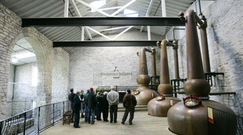 A tour group looks over the copper stills at the Woodford Reserve distillery.