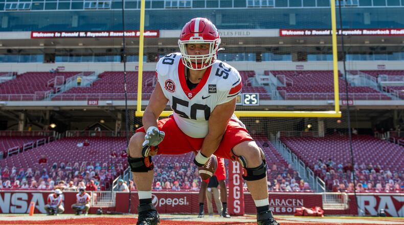 Georgia offensive lineman Warren Ericson practices at center during pregame warmups for the Arkansas game on Sept. 26 in Fayetteville, Ark. (By Tony Walsh/UGA)